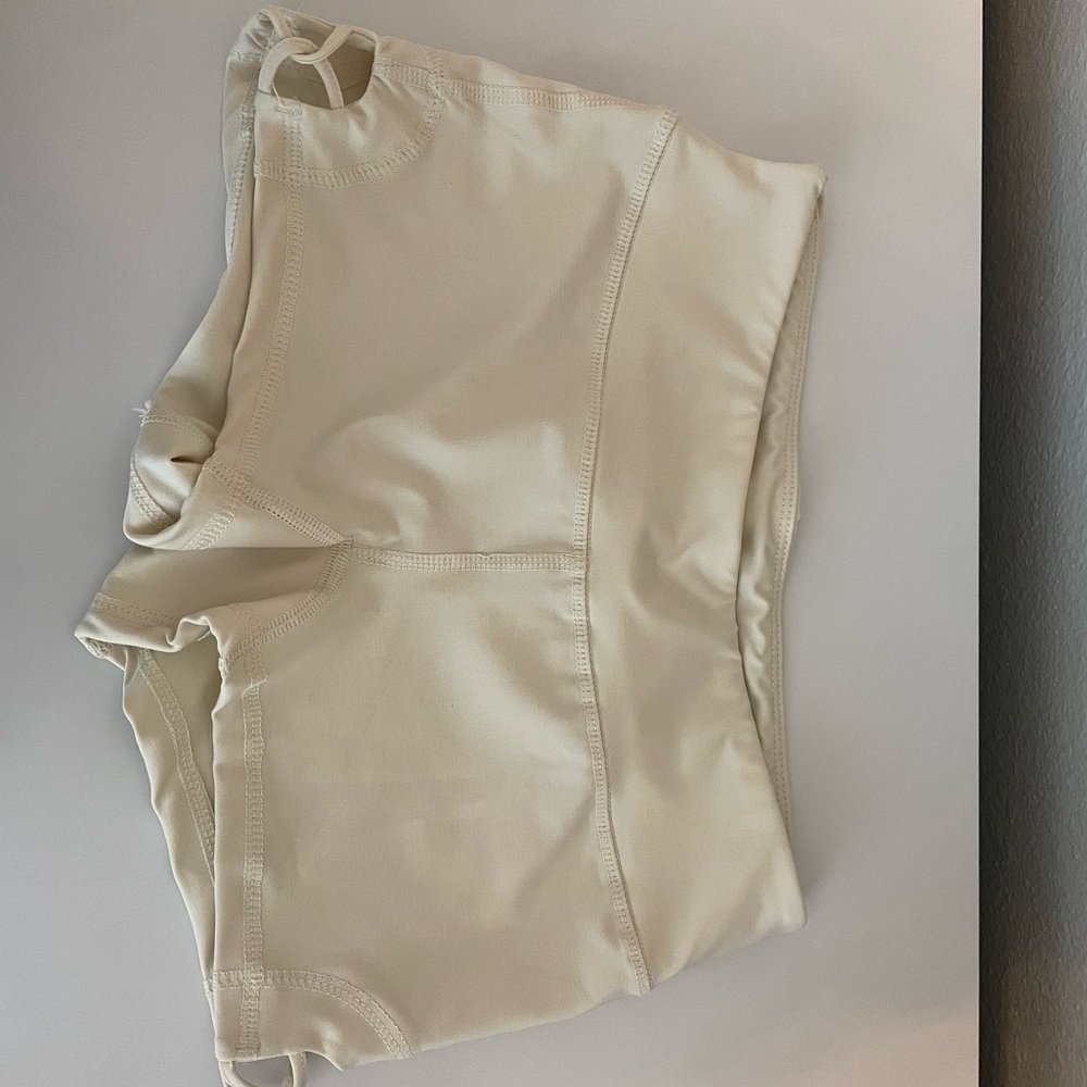 tan booty shorts with design on the side
